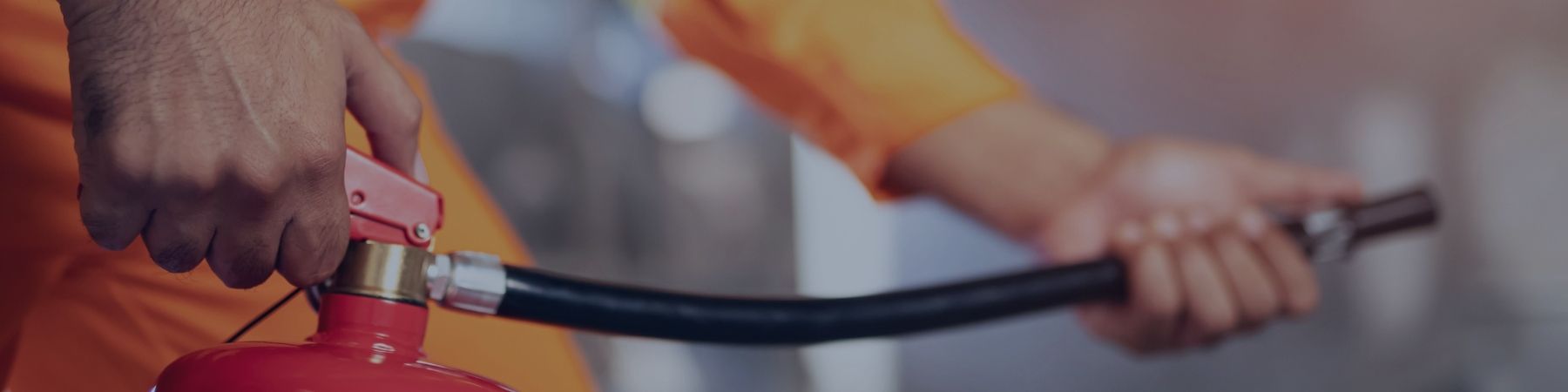 Hands holding fire extinguisher